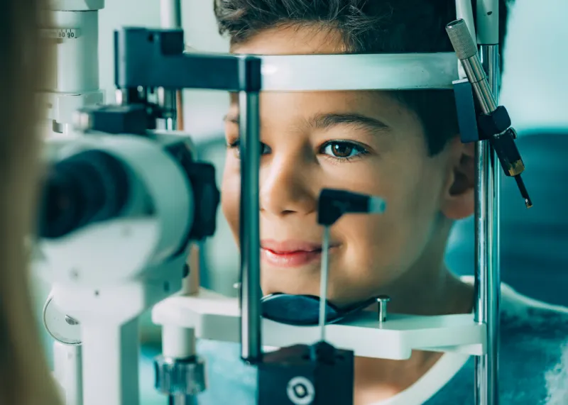 An ophthalmologist examining a patient's eyes with clinical equipment at an eye hospital in Istanbul, Turkey.