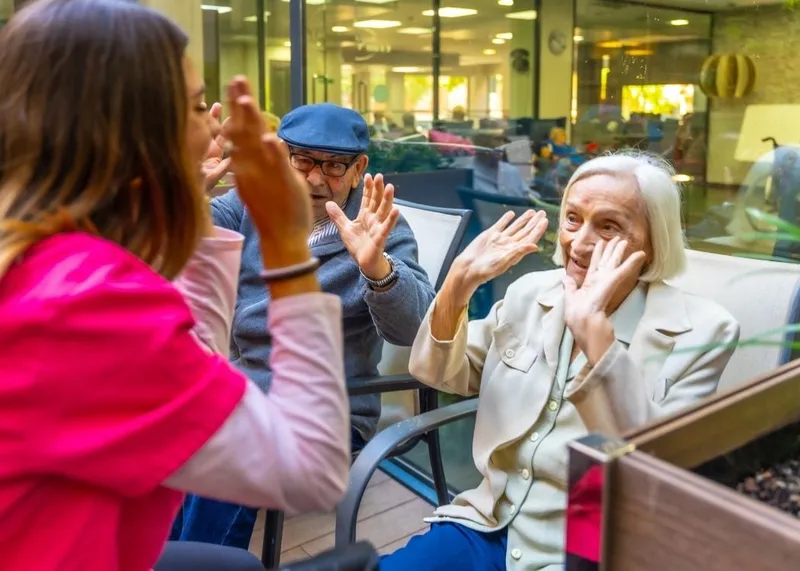 An elderly couple at home supported by a caregiver in Istanbul