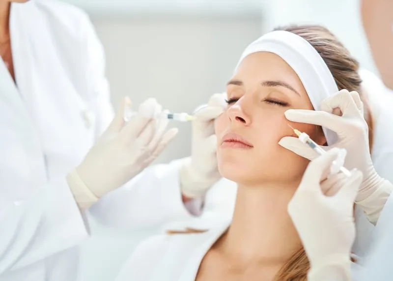 Patient receiving a non-surgical facial aesthetic treatment at a medical aesthetic center in Istanbul