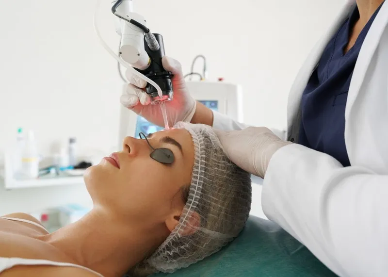 A patient receives laser skin resurfacing treatment to reduce wrinkles and sun damage.