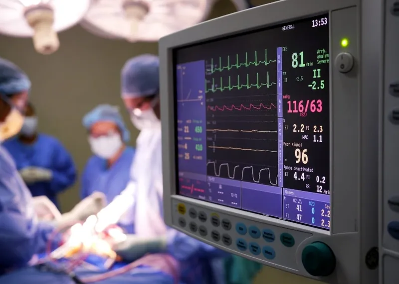 Cardiologist explaining heart valve treatment options to a patient using imaging results