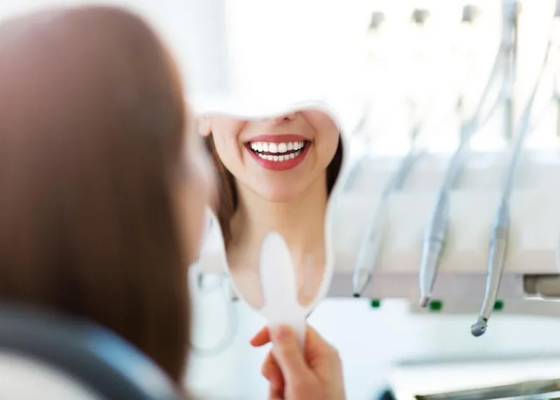 Samples of different dental crown types displayed at a dental laboratory.