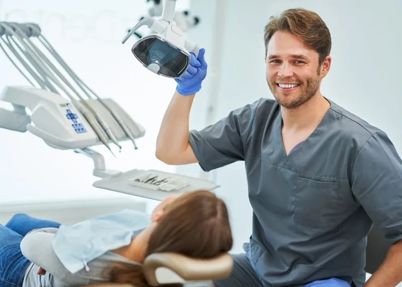 A dentist treats an international patient in the dental department of a large Istanbul hospital.