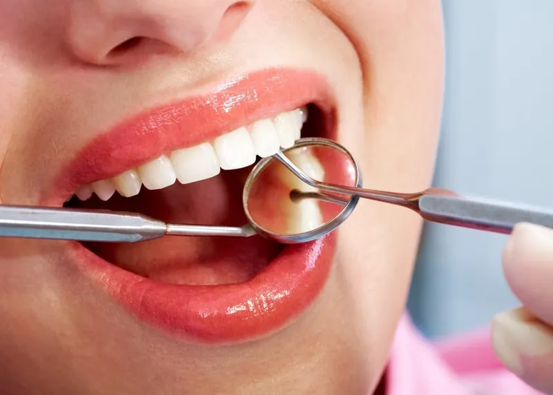 A patient reviews a written treatment plan and cost breakdown at an Istanbul dental clinic.