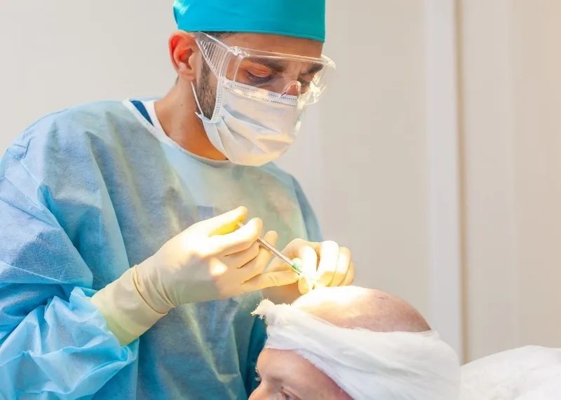 A patient at an Istanbul clinic shortly after completing a hair transplant procedure.