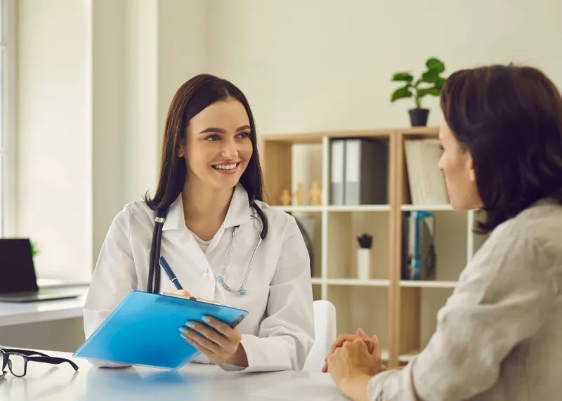Patient reviewing international health insurance and hospital accreditation documents before treatment in Istanbul