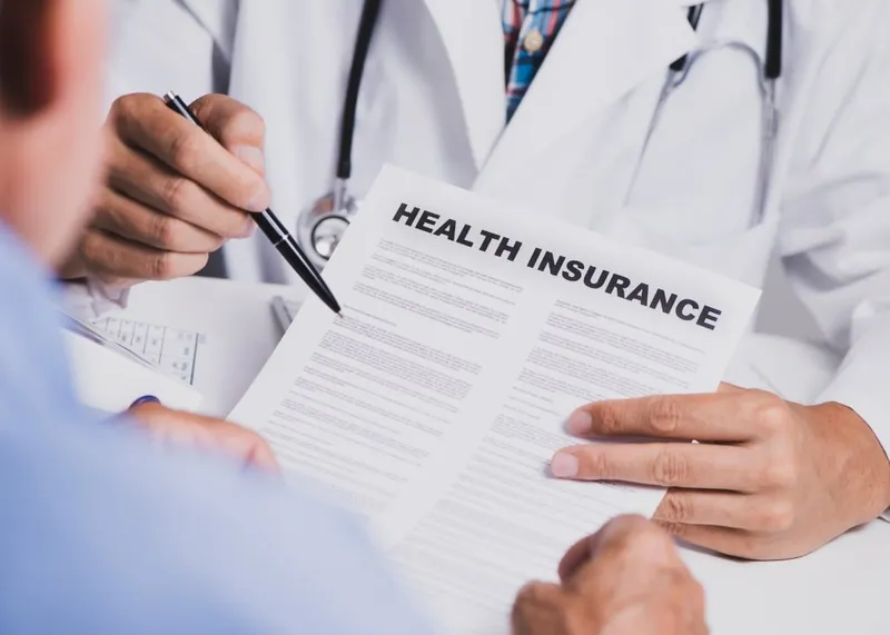 International patient going over private health insurance options at an Istanbul clinic