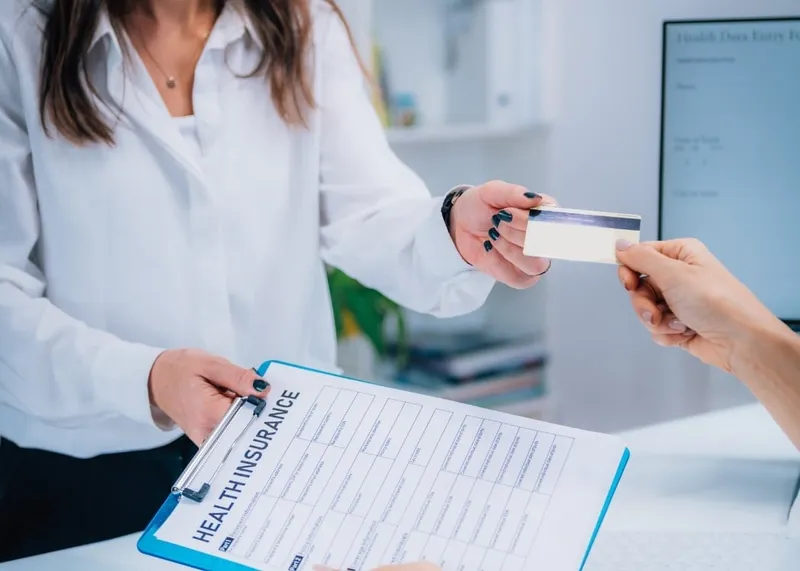 Traveler reviewing health insurance documents before a trip to Istanbul