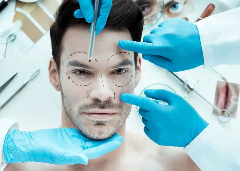 Board-certified plastic surgeon talking through procedure options with a patient