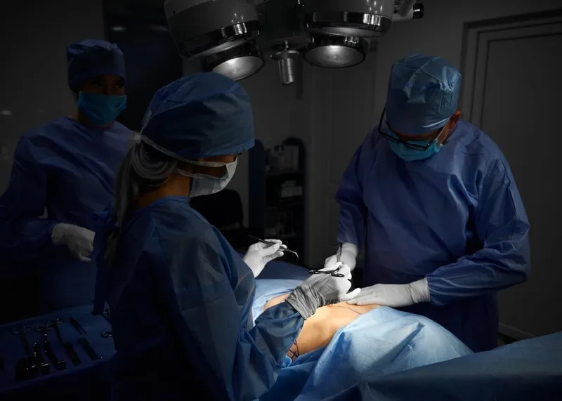 Care team walking a patient through a written day-by-day recovery schedule